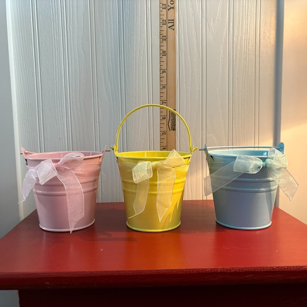 Lot of three pastel pails with delicate ribbon for Easter or spring decorating